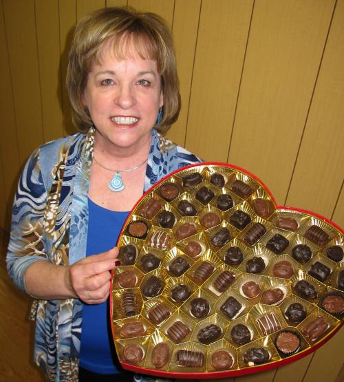 Woman holding a big box of chocolate